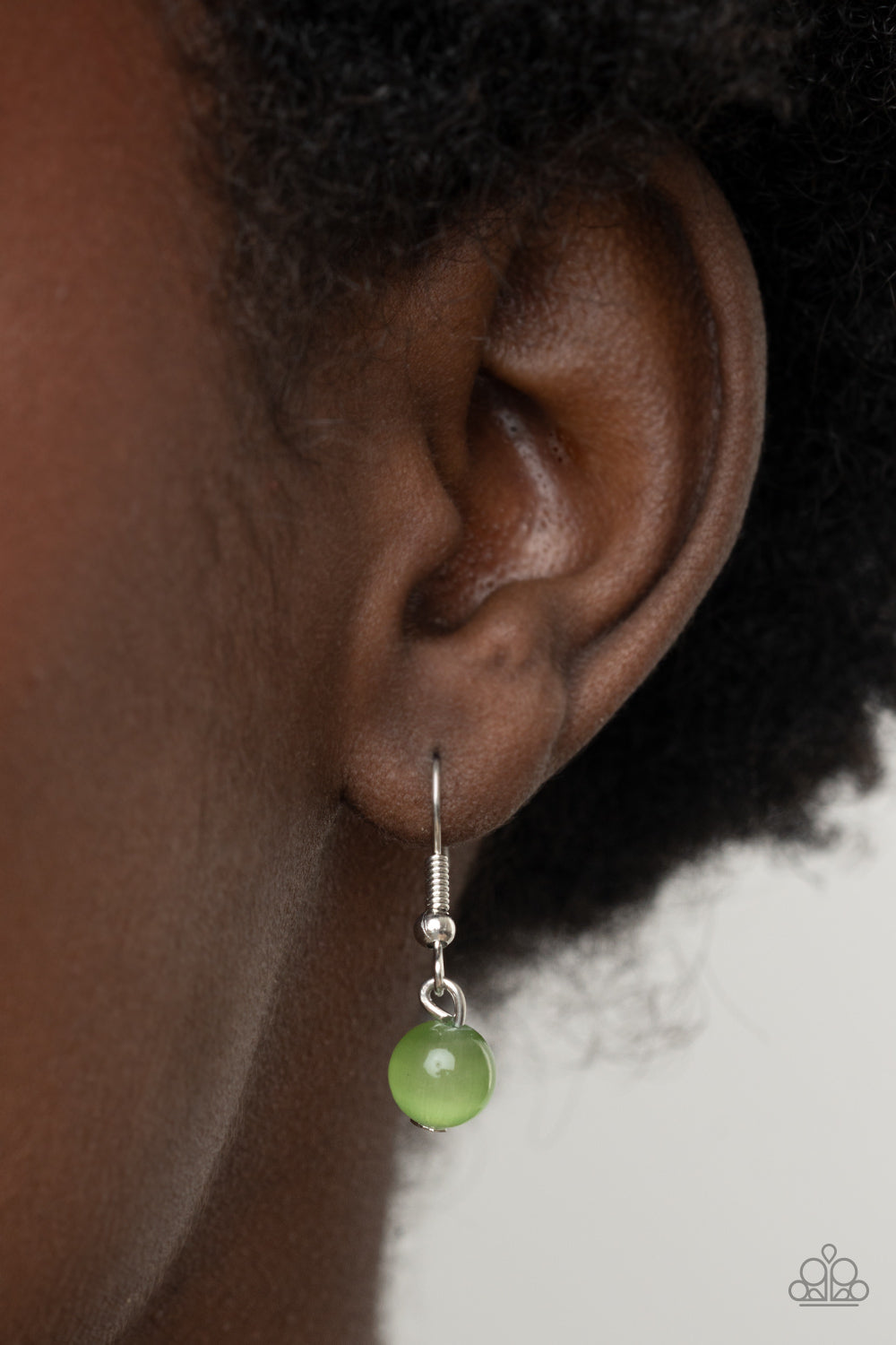 ​Ethereally Elemental - Green Cat's Eye Stone and Silver Necklace - Paparazzi Accessories - 
A shell-like accent is pressed into the center of a studded silver frame that sits atop a silver rope-like frame that is dotted with a square Green Ash cat's eye stone. The colorful pendant swings from a shiny silver chain, creating an ethereal pendant below the collar. Features an adjustable clasp closure.
