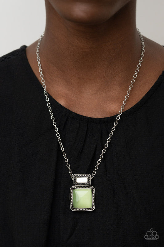 ​Ethereally Elemental - Green Cat's Eye Stone and Silver Necklace - Paparazzi Accessories - 
A shell-like accent is pressed into the center of a studded silver frame that sits atop a silver rope-like frame that is dotted with a square Green Ash cat's eye stone. The colorful pendant swings from a shiny silver chain, creating an ethereal pendant below the collar. Features an adjustable clasp closure.

