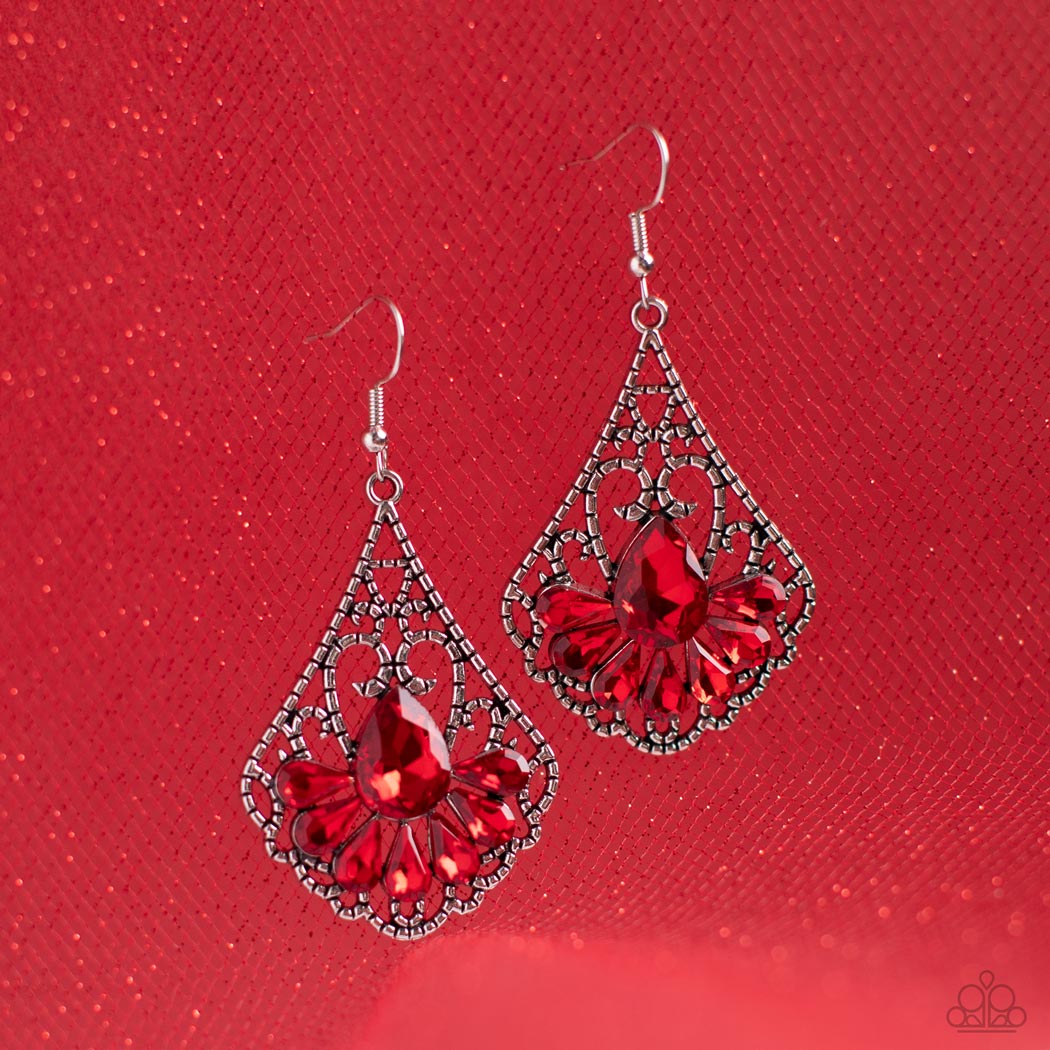 Exemplary Elegance - Red and Silver Earrings - Paparazzi Accessories - A sparkly collection of fiery red teardrop rhinestones fan out across the bottom of a textured filigree filled teardrop frame, creating an elegant centerpiece. Earring attaches to a standard fishhook fitting. Sold as one pair of earrings.