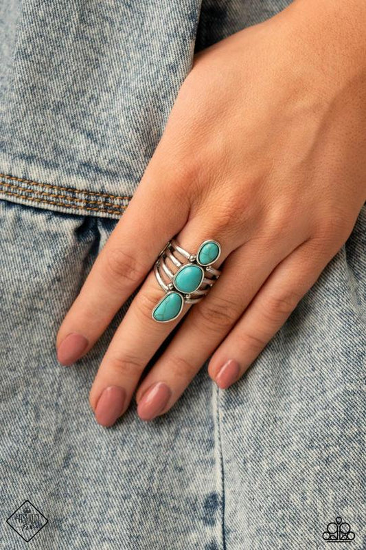 Extra Eco - Blue Turquoise and Silver Ring - Paparazzi Accessories - Encased in sleek silver frames, a row of turquoise stones coalesce into a unique handcrafted centerpiece atop layered silver bands. Features a stretchy band for a flexible fit. Sold as one individual stylish fashion ring.