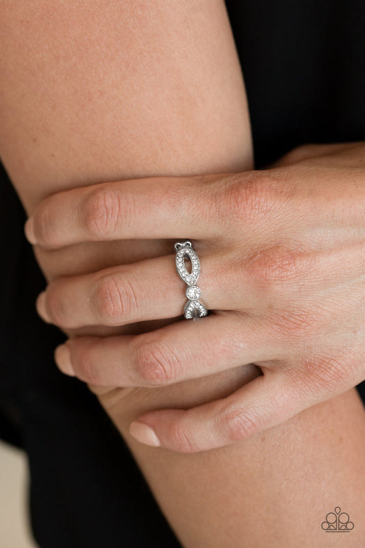 Extra Side of Elegance - White and Silver Fashion Ring - Paparazzi Accessories - Glassy white rhinestones, glistening silver ribbons loop away from a dazzling white rhinestone center for a refined look. Features a dainty stretchy band for a flexible fit.