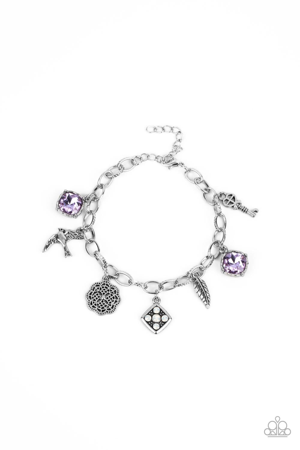 Fancifully Flighty - Purple Gem - Silver Charm Bracelet - Paparazzi Accessories - Sparkling purple gems, a floral medallion, a bird in flight, and a fluttering feather dangle from a delicate silver chain as they coalesce into a whimsical charm bracelet. Features an adjustable clasp closure. Sold as one fashion charm bracelet.