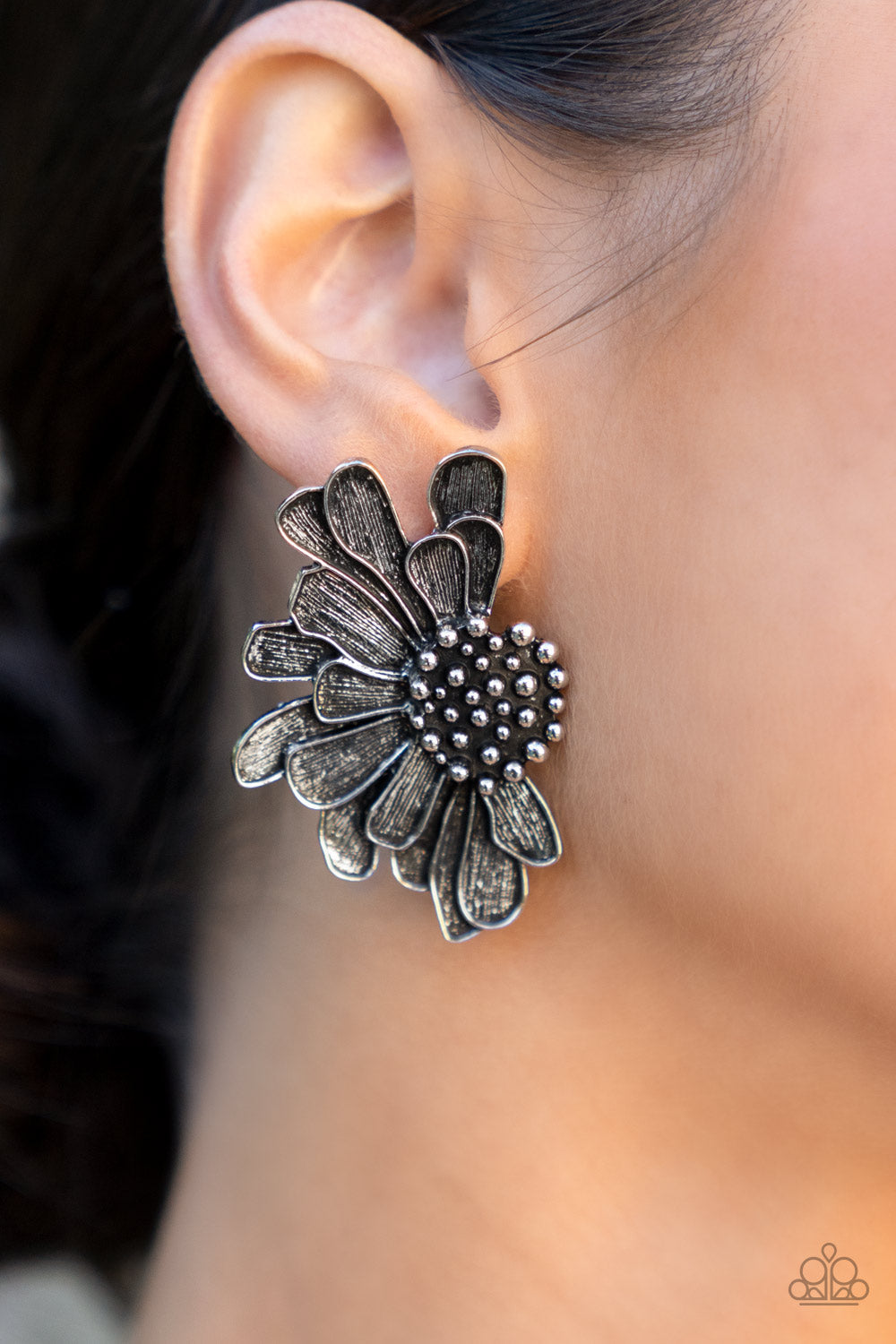 Farmstead Meadow - Silver Petal Earrings - Paparazzi Accessories - Imperfect silver petals bloom from a studded center, layering into a rustic half blossom for a whimsical flair.