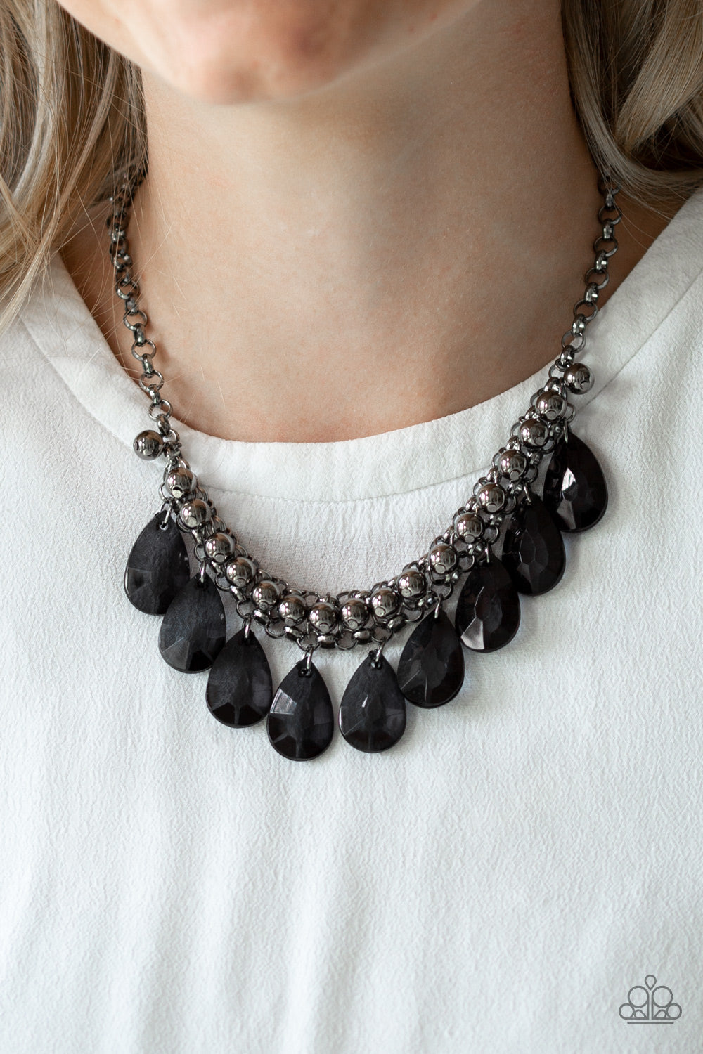 Fashionista Flair - Black and Gunmetal Necklace - Paparazzi Accessories - A row of glistening gunmetal beads gives way to glassy black teardrops, creating a bold tone on tone fringe below the collar. Features an adjustable clasp closure. Sold as one individual necklace.