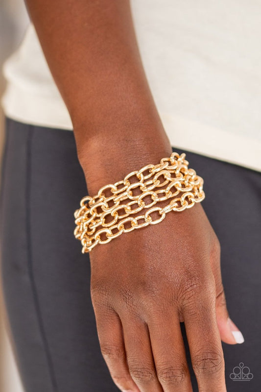 Fast Ball Gold Fashion Bracelet - Paparazzi Accessories - Four strands of bold gold chain layer across the wrist for an edgy stylish bracelet. Features an adjustable clasp closure. Sold as one individual bracelet.