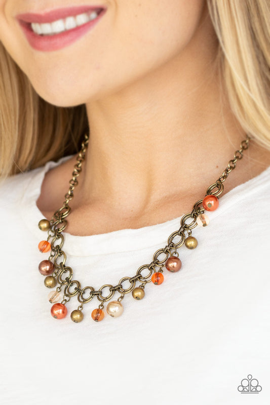 Fiercely Fancy - Brass and Orange Necklace - Paparazzi Accessories - Pearly and glassy brass, brown, and orange beads swing from a double-linked brass chain, for a fancy fringe below the collar fashion necklace.