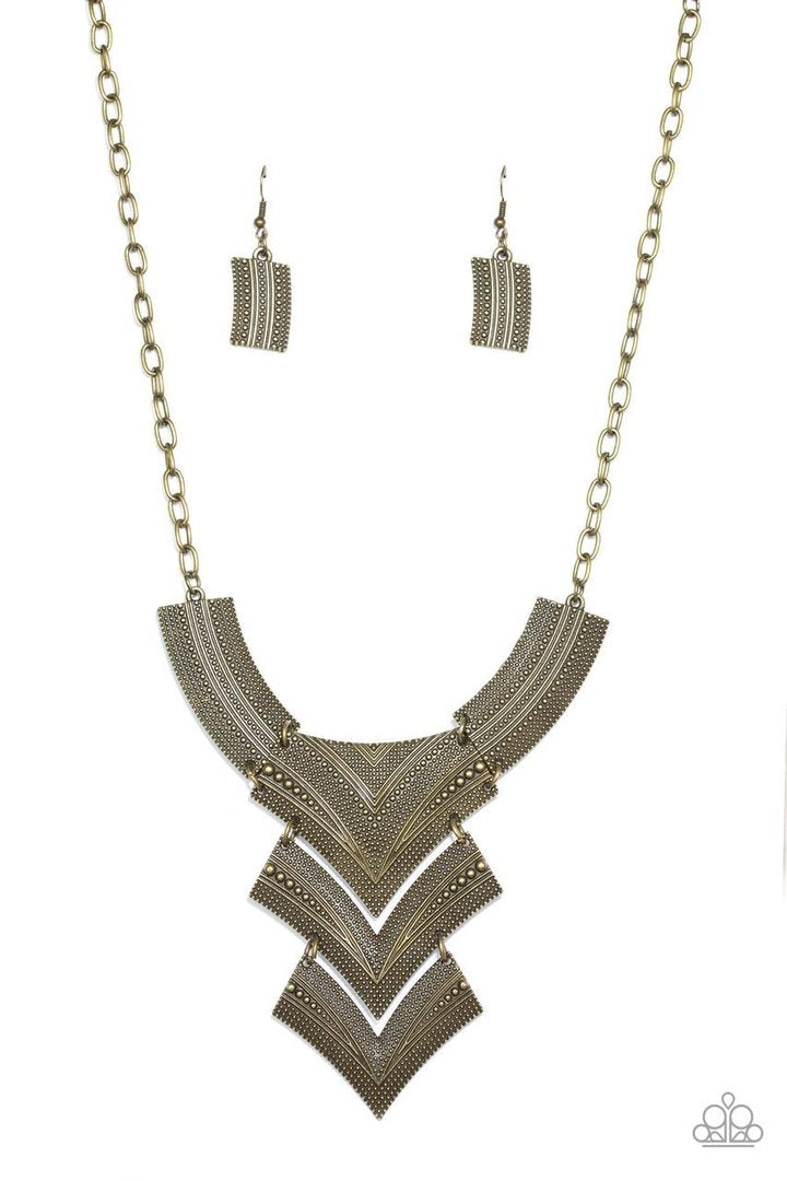 Fiercely Pharaoh - Brass Fashion Necklace - Paparazzi Accessories - Radiating in studded details, antiqued brass plates link below the collar, joining into a fierce geometric pendant. Features an adjustable clasp closure. Sold as one individual necklace.