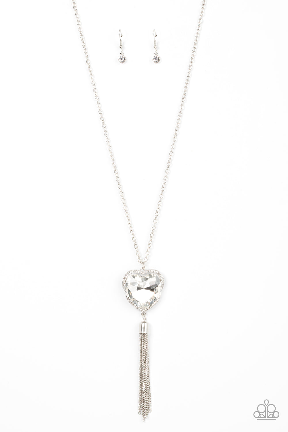 Finding My Forever - White Gem Heart and Silver Necklace - Paparazzi Accessories - Bordered in a ribbon of glassy white rhinestones, an oversized white heart-shaped gem seemingly floats at the bottom of an extended silver chain. A shimmery silver chain tassel dances from the bottom of the sparkly pendant for a flirtatious finish.