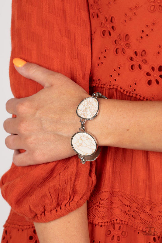 Flat Out Frontier - White and Silver Bracelet - Paparazzi Accessories - Flat white marbled stones pressed into shiny-silver frames provide a statement focal point around the wrist. Features an adjustable clasp closure.