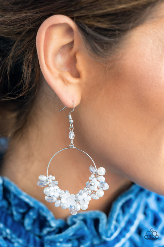 Floating Gardens - White Pearl Floral - Silver Earrings - Paparazzi Accessories - A timeless collection of iridescent crystal-like accents, dainty white pearls, and white floral frames delicately cluster along the bottom of a silver hoop, creating a glamorous glow. Earring attaches to a standard fishhook fitting.