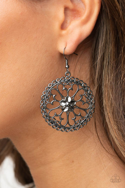 ​Floral Fortunes - Black Metal Flower - Butterfly Earrings - Paparazzi Accessories - 
Airy butterfly shaped gunmetal frames fan out from a gunmetal flower, creating a whimsical centerpiece inside a hoop of dainty gunmetal infinity accents. Earring attaches to a standard fishhook fitting.
Sold as one pair of earrings.
