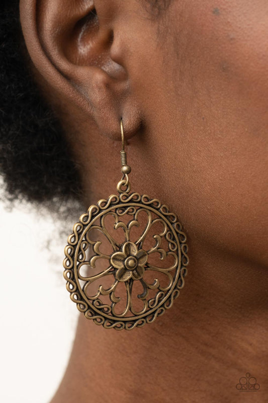 Floral Fortunes - Brass Flower Fashion Earrings - Paparazzi Jewelry  - Bejeweled Accessories By Kristie - Airy butterfly shaped brass frames fan out from an antiqued brass flower, creating a whimsical centerpiece inside a hoop of dainty brass infinity accent fashion earrings. 