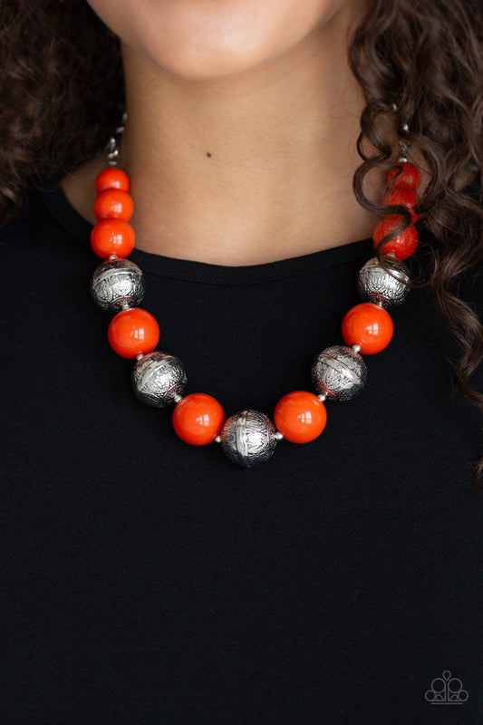 Floral Fusion - Orange and Silver Necklace - Paparazzi Accessories - Infused with dainty silver accents, a bubbly collection of hearty orange beads and floral embossed silver beads are threaded along an invisible wire below the collar for a seasonal look. Features an adjustable clasp closure.