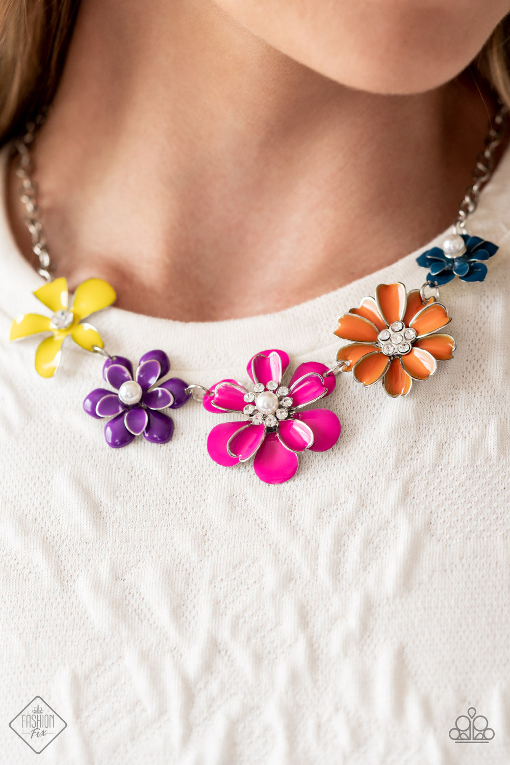 Floral Reverie - Multi Color Flower Necklace - Paparazzi Accessories - Colorful flowers blooms to life along the collar, creating a vibrant statement piece. Each flower features a different centerpiece, flawlessly sprinkling the design with whimsical sparkle and shimmery pearls. Silver edging outlines some of the layered petals, emphasizing the handcrafted character of the design. Features an adjustable clasp closure fashion necklace.