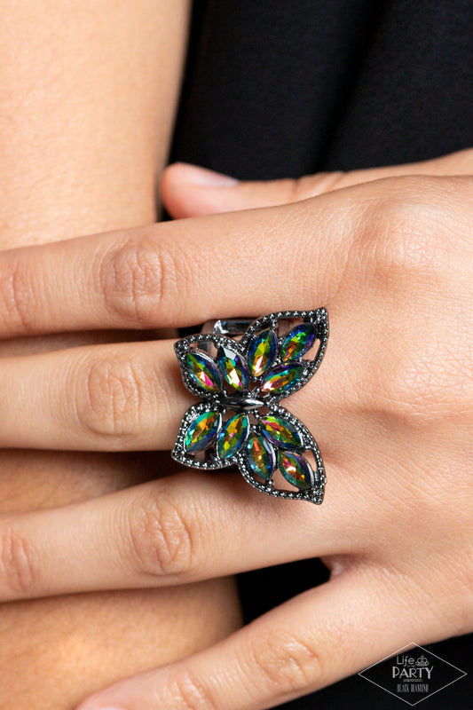 Fluttering Fashionista - Multi Color - Oil Spill and Black Ring - Paparazzi Accessories - The wings of a studded gunmetal butterfly have been adorned in glittery oil spill marquise rhinestones, creating a glamorous centerpiece atop the finger.