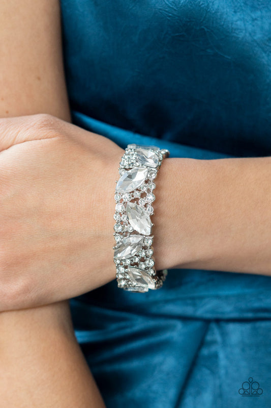 Full Body Chills - Silver and White Bling Bracelet - Paparazzi Accessories - Oversized marquise cut white rhinestones sparkle atop icy frames of dainty silver studs and white rhinestones that are threaded along stretchy bands around the wrist for a jaw-dropping dazzle fashion bracelet.