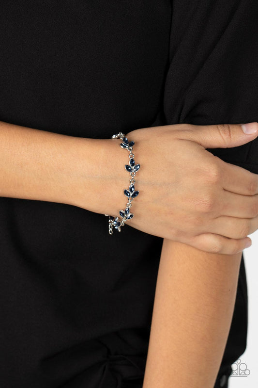 Gala Garland - Blue and Silver Bracelet - Paparazzi Accessories - Twinkling marquise cut blue rhinestones gather into leafy frames as that link around the wrist for a radiant fashion bracelet. Features an adjustable clasp closure.