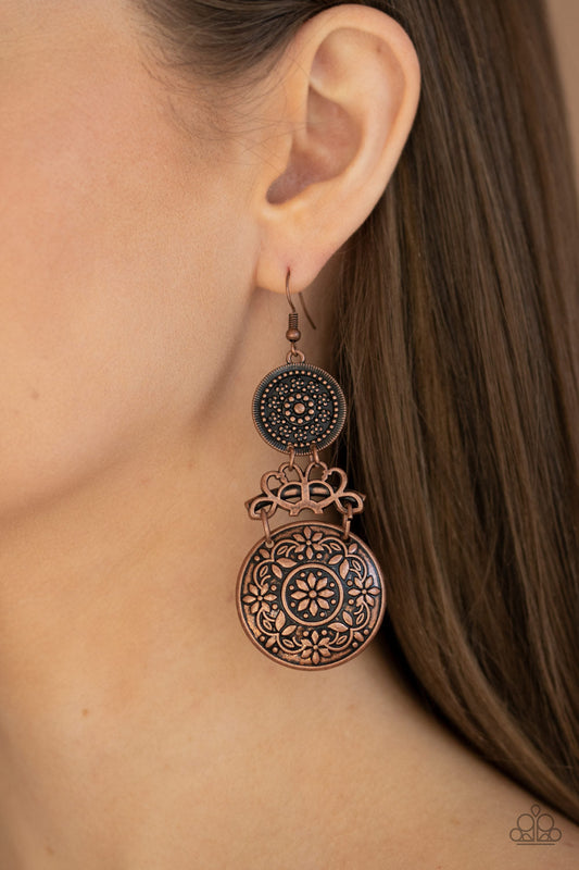 Garden Adventure - Copper Earrings - Paparazzi Accessories - Embossed and studded in antiqued floral patterns, flowery copper discs flank a vine-like copper fitting, coalescing into a whimsical lure. Earring attaches to a standard fishhook fitting. Sold as one pair of earrings.