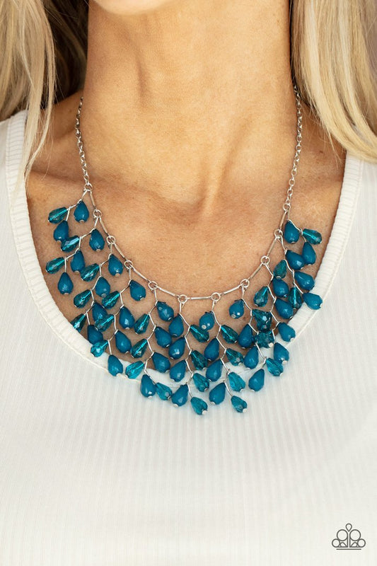 Garden Fairytale - Blue and Silver Necklace - Paparazzi Accessories - A shimmery collection of opaque and clear crystal-like Mykonos Blue teardrop beads delicately cluster along a linked strand of silver bars, creating an ethereally leafy fringe below the collar. Features an adjustable clasp closure. Sold as one individual necklace.