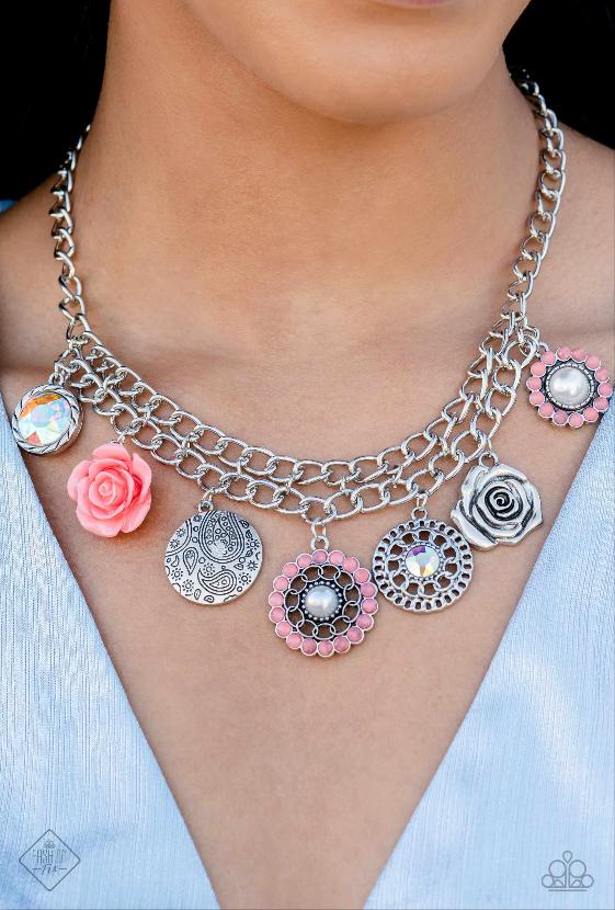 Garden Grace - Orange and Silver Necklace - Paparazzi Accessories - A collection of whimsical botanical charms gathers along a flat, silver, double-curbed chain. The featured charms include a Peach Pink resin flower, a metallic rose, a silver disc stamped with a paisley motif, an oversized, faceted orange iridescent gem bordered in textured silver, an iridescent gem encompassed by alternating chains, and a pearl-centered flower with Peach Pink gem petals, creating a floral fantasy.