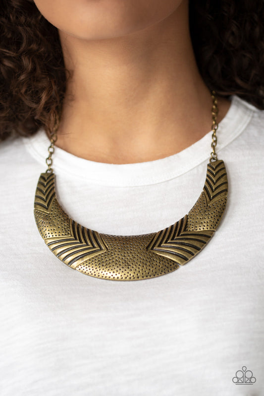 Geographic Goddess - Brass Fashion Necklace - Paparazzi Accessories - Featuring angular shapes, a collection of hammered and chevron-like stamped frames connect below the collar, coalescing into a bold statement fashion necklace. 