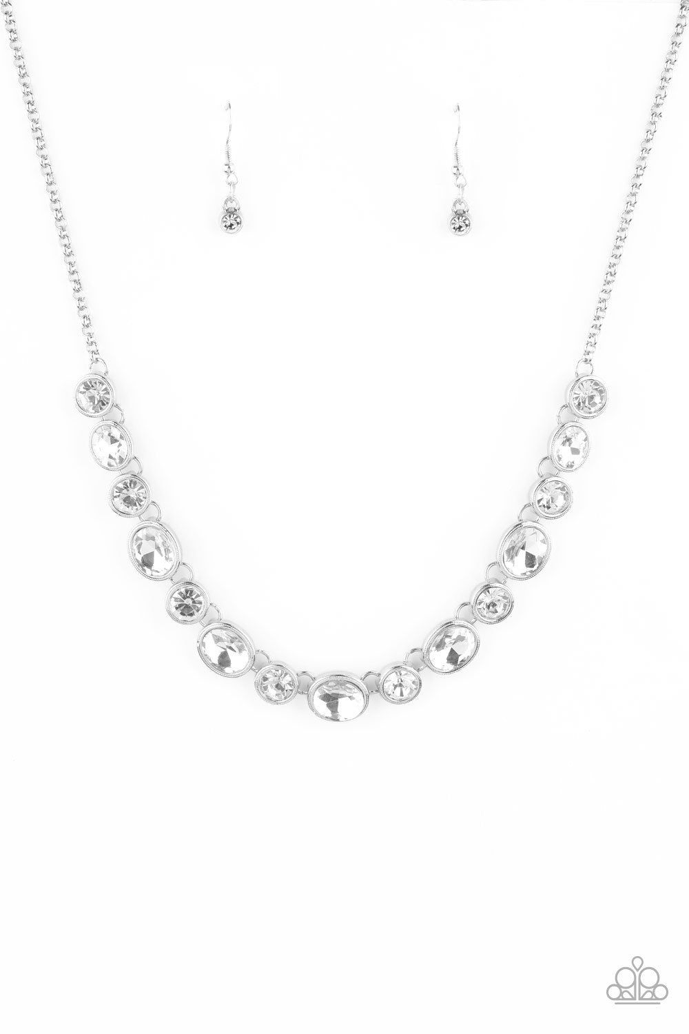 Girls Gotta Glow - White and Silver Fashion Necklace - Paparazzi Accessories -Encased in sleek silver frames, oval and round white rhinestones alternate below the collar for a timeless look. Features an adjustable clasp closure. Sold as one individual necklace.