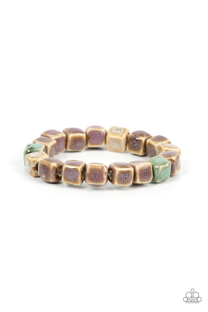 Glaze Craze - Purple and Brown Ceramic Bracelet - Paparazzi Accessories - Featuring distressed purple, blue, and brown glazed finishes, a rustic collection of ceramic cube beads are threaded along stretchy bands around the wrist for a colorful flair.