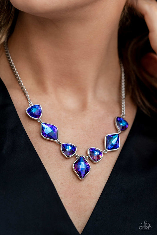 Glittering Geometrics - Purple and Silver Necklace - Paparazzi Accessories - Set in silver frames, glittering geometric purple shapes with a UV shimmer delicately coalesce around the collar for a statement necklace.