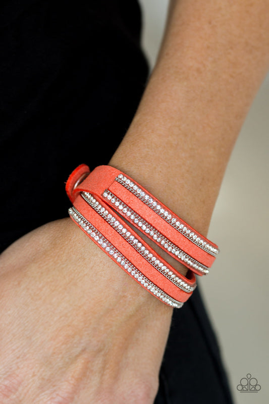 Going For Glam - Orange Suede Wrap - Snap Bracelet - Paparazzi Accessories - An elongated orange suede band is encrusted in rows of glassy white rhinestones and shimmery silver chains. The elongated band double wraps around the wrist for a fierce one-of-a-kind look. Features an adjustable snap closure. Sold as one individual bracelet.