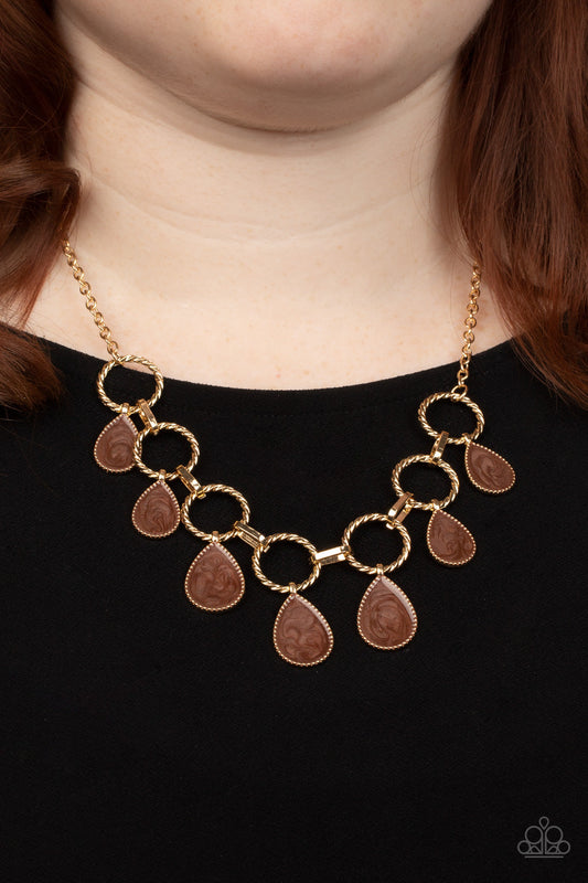 Golden Glimmer - Brown Necklace - Paparazzi Accessories - Swirling with brown glazed finishes, textured gold teardrops swing from the bottoms of spun gold hoops that link with pinched gold fittings below the collar, resulting in a refined fringe below the collar.