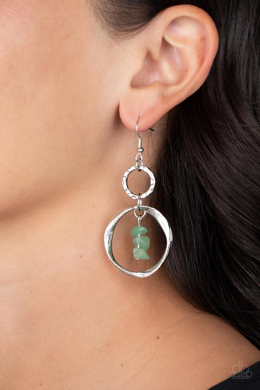 Good-Natured Spirit - Jade Green Earrings - Paparazzi Accessories - A warped silver hoop links with a hammered silver hoop, interlocking into a rustic lure. Threaded along a metal rod, jade pebbles trickle from the top of the lowermost hoop for a tranquil finish.