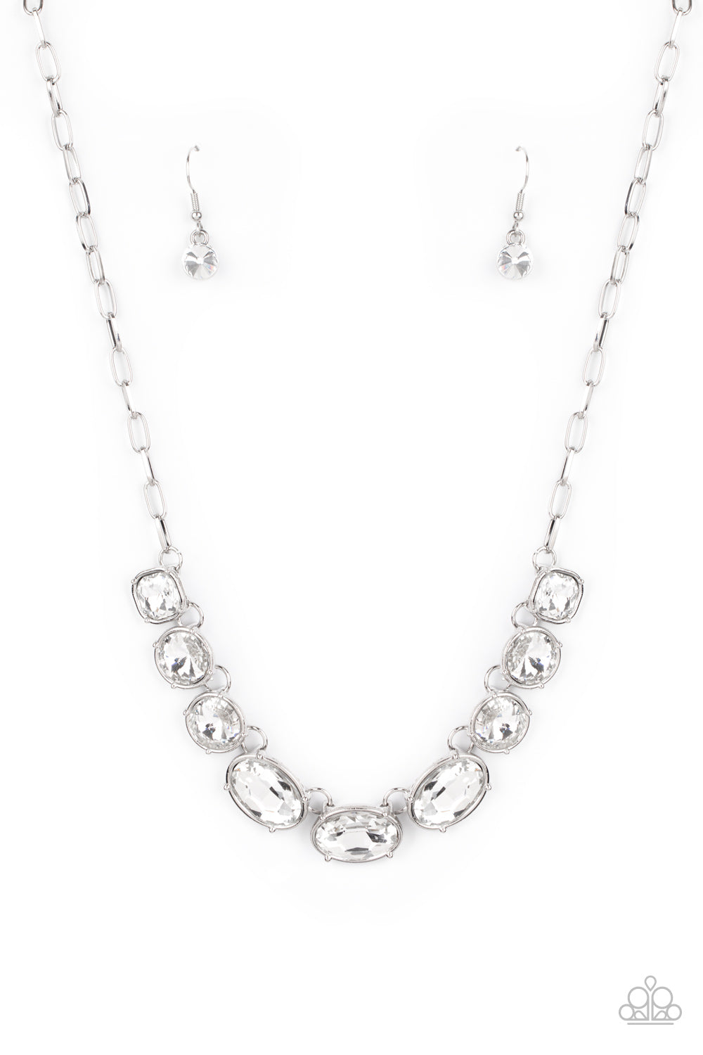 Gorgeously Glacial - White and Silver Necklace - Paparazzi Accessories - 
Featuring mismatched round, oval, and square cuts, a glittery row of dramatically oversized white rhinestones delicately link below the collar for an icy finish. Features an adjustable clasp closure.
Sold as one individual necklace.