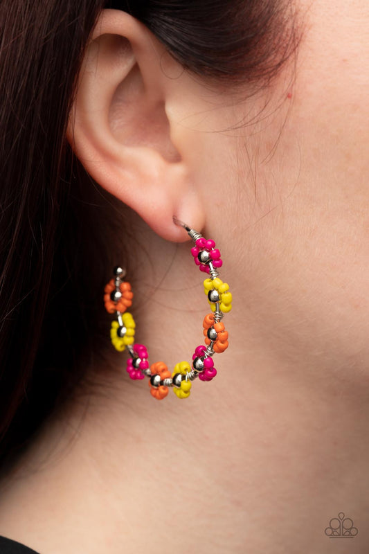 Growth Spurt - Multi Color Flower Earrings - Paparazzi Accessories - Adorned with shiny silver beaded centers, a dainty collection of Illuminating, orange, and Fuchsia Fedora seed beaded rings create vivacious flower accents along a classic silver hoop for a flamboyant floral display. Earring attaches to a standard post fitting. Hoop measures approximately 1 1/2" in diameter. Sold as one pair of hoop earrings.
