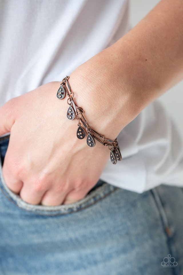Gypsy Glee - Copper Teardrop - Chain Bracelet - Paparazzi Accessories - Glistening copper rods and ornate teardrops link around the wrist in two rows, creating a playful fringe fashionbracelet. Features an adjustable clasp closure. Bejeweled Accessories By Kristie - Trendy fashion jewelry for everyone -