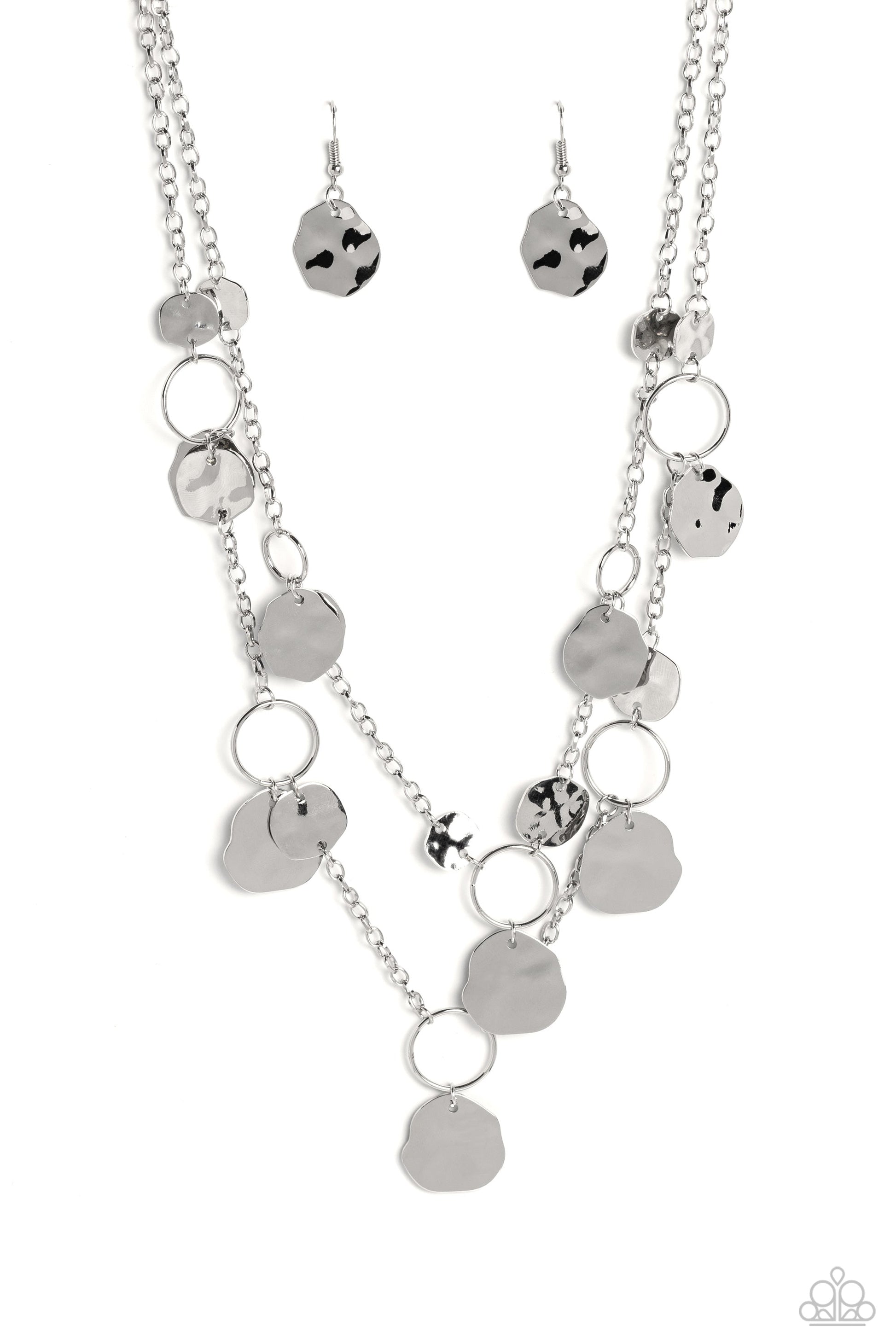 Hammered Horizons - Silver Necklace - Paparazzi Accessories - Infused along two silver chains, smooth silver hoops and abstract, hammered silver discs fall down the neckline for an edgy, boisterous display.