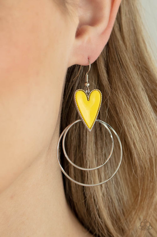 Happily Ever Hearts - Yellow and Silver Earrings - Paparazzi Accessories - Dainty silver hoops attach to the bottom of a playful Illuminating heart frame, creating a flirtatious pop of color. Earring attaches to a standard fishhook fitting. Sold as one pair of earrings.