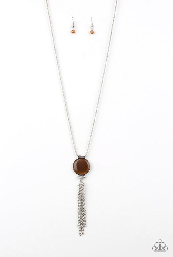 Happy As Can BEAM - Brown and Silver Necklace - Paparazzi Accessories - Infused with white rhinestone encrusted fittings, a glowing brown cat's eye stone pendant swings from the bottom of a rounded silver mesh chain for a whimsical look. Features an adjustable clasp closure. Sold as one individual necklace. Includes one pair of matching earrings.