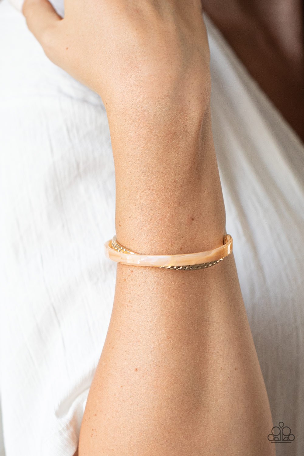 HAUTE On The Trail - Gold Acrylic Bracelet - Paparazzi Accessories - Featuring a marble-like finish, a golden acrylic frame curls around a dainty gold cuff, creating a colorfully stacked look across the wrist. Sold as one individual bracelet.