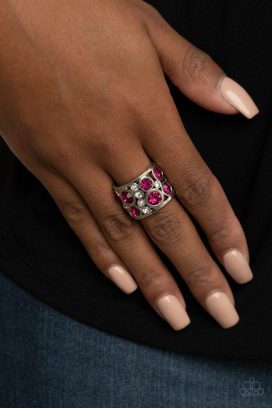High Roller Royale - Pink and Silver Ring - Paparazzi Accessories - 
Sporadic sections of dainty white rhinestones and oversized pink rhinestones haphazardly coalesce inside an airy silver frame, creating a dramatically dazzling centerpiece around the finger. Features a stretchy band for a flexible fit. Sold as one individual ring.
