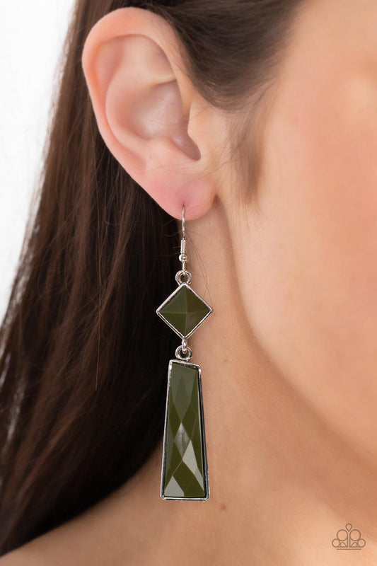 Hollywood Harmony - Green and Silver Earrings - Paparazzi Accessories - Encased in sleek silver fittings, a faceted trapezoidal Olive Branch bead swings from the bottom of a faceted square Olive Branch bead that is gently tilted for a trendy pop of color. Earring attaches to a standard fishhook fitting. Sold as one pair of earrings. Trendy fashion jewelry for everyone.