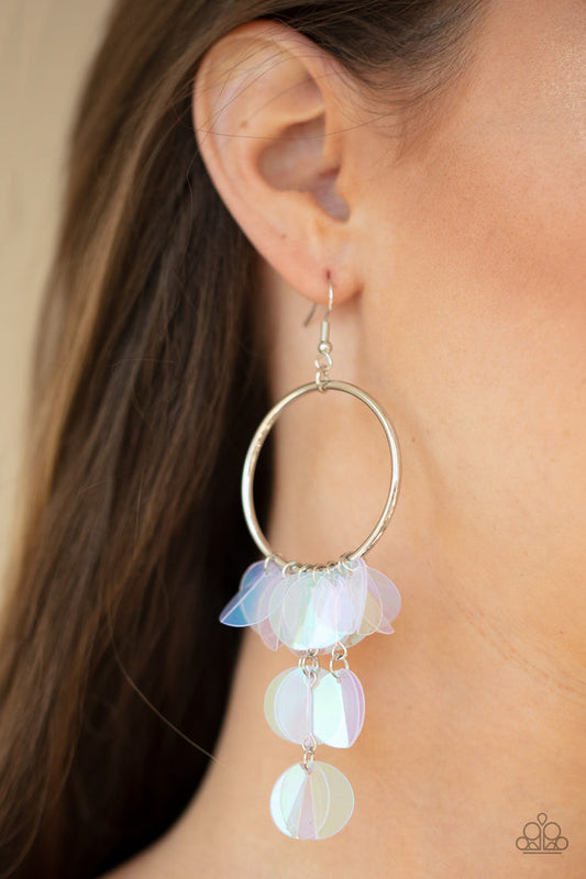 Holographic Hype - Colorful - Trendy Iridescent Earrings - Paparazzi Accessories - Delicately folded in half, tassels of creased iridescent sequins swing from the bottom of a shiny silver hoop, creating an effervescent fringe. Earring attaches to a standard fishhook fitting. Sold as one pair of earrings.