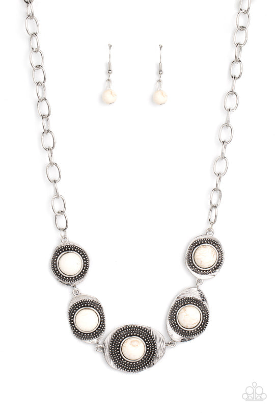 Homestead Harmony - White Crackle and Silver Necklace - Paparazzi Accessories - Refreshing white stones dot the centers of wavy irregular-shaped frames. Embellished with studded and etched feathery texture, the rustic frames create an earthy artisanal display below the collar. Features an adjustable clasp closure. Sold as one individual necklace.