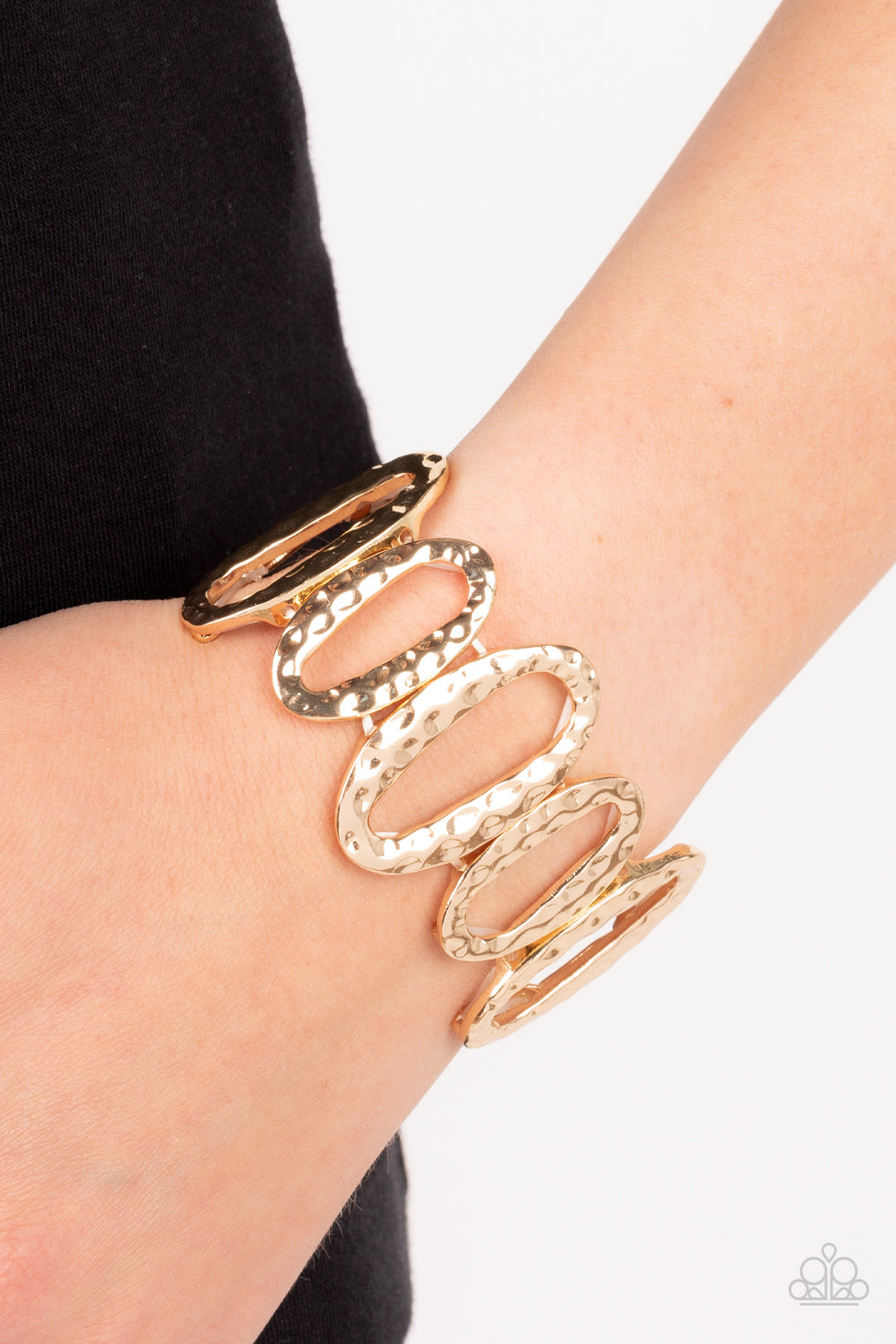 Homestead Heirloom - Gold Bracelet - Paparazzi Accessories - Hammered large and medium sized gold oval frames alternate along stretchy bands around the wrist for a handcrafted vibe bracelet.