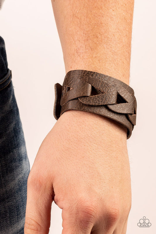 Horse and Carriage - Brown Leather Urban Bracelet - Paparazzi Accessories - Featuring airy triangular cutouts,  leather links interlock across the center of a distressed leather band for a rustic flair. Features an adjustable snap closure. Sold as one individual bracelet.
