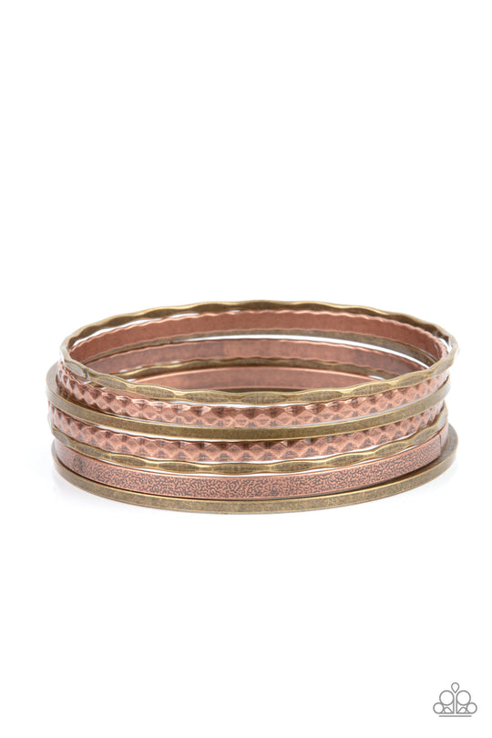 How Do You Stack Up? - Multi Metal (Brass and Copper) Bangle Bracelet - Paparazzi Accessories - Varying in hammered, diamond-cut, and shiny finishes, a collection of mismatched copper and brass bangles stack across the wrist for an intense industrial look. Sold as one set of seven bracelets.