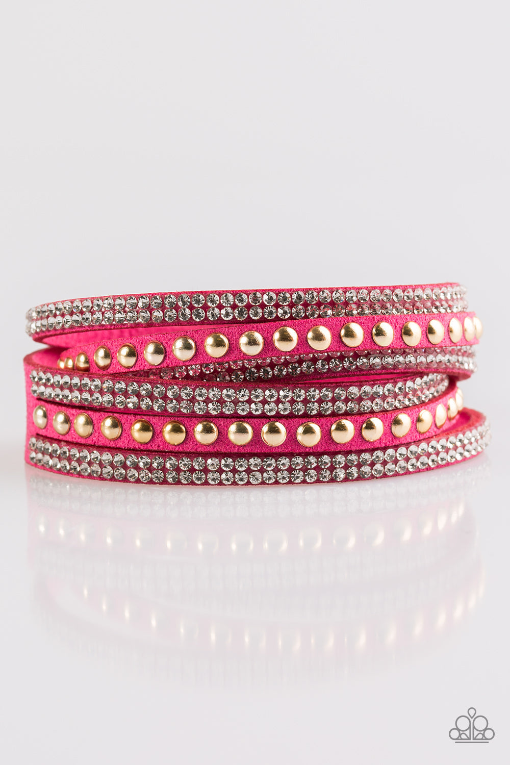 I BOLD You So! - Pink and Gold Wrap Bracelet - Paparazzi Accessories - Rows of glassy white rhinestones and glistening gold studs are pressed along three strands of pink suede for a sassy look. The elongated band allows for a trendy double wrap design. Features an adjustable snap closure. Sold as one individual bracelet.