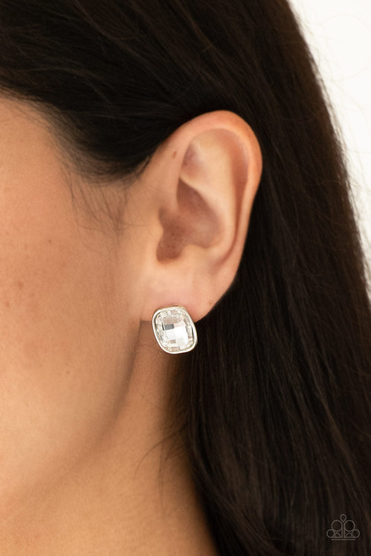 Incredibly Iconic - White and Silver Gem Earrings - Paparazzi Accessories Silver - A faceted white gem is pressed into a sleek silver frame for a glamorous look. Earring attaches to a standard post fitting. Sold as one pair of post earrings.