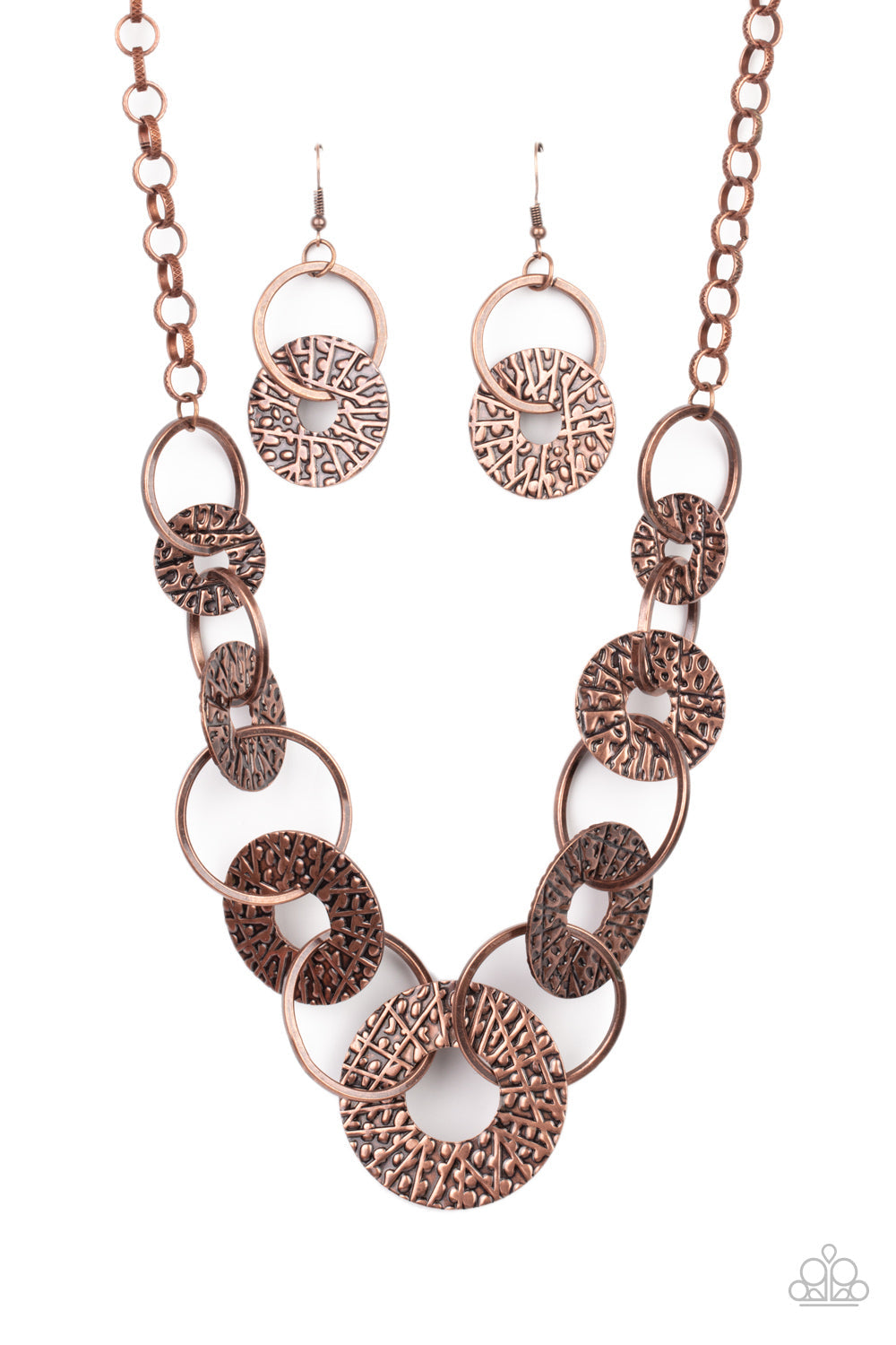​Industrial Envy - Copper Necklace - Paparazzi Accessories - Gradually increasing in size near the center, a collection of antiqued copper rings and abstract hammered discs interlock below the collar for an intense industrial look. Features an adjustable clasp closure. Sold as one individual necklace. Includes one pair of matching earrings.