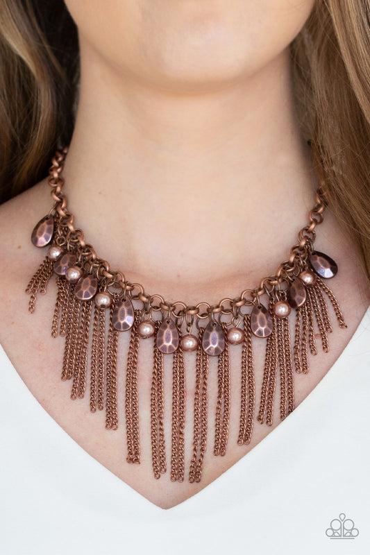 Industrial Intensity Copper Necklace - Paparazzi Accessories - Bejeweled Accessories By Kristie - A collection of faceted copper teardrops and pearly copper beads drip from the bottom of an antiqued copper chain. Pairs of copper chains stream from the of the chain, creating a intensely tapered fringe below the collar. Features an adjustable clasp closure. Sold as one individual necklace. Includes one pair of matching earrings.
