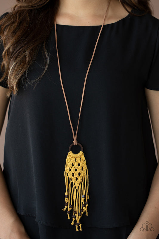 Its Beyond MACRAME! - Yellow and Brown Wood Necklace - Paparazzi Accessories - Square wooden beads are knotted at the ends of golden yellow twine-like cording that braids and weaves around a wooden hoop, creating an earthy macramé pendant at the bottom of a dainty piece of brown suede. Features an adjustable knotted closure. Sold as one individual necklace.